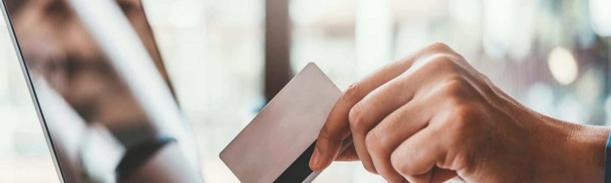 Online banking businessman using Laptop with credit card Shopping online Fintech and Blockchain concept